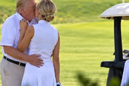 That Photo of Donald Trump Kissing Natalie Harp Has One Big Problem