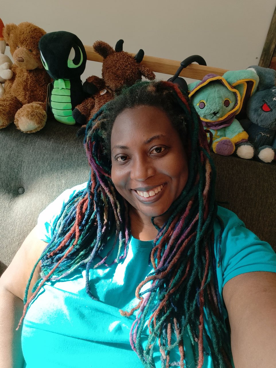 Portrait Selfie taken with Oppo Find 8X Pro Smartphone of African-American woman with colored locks wearing a teal t-shirt