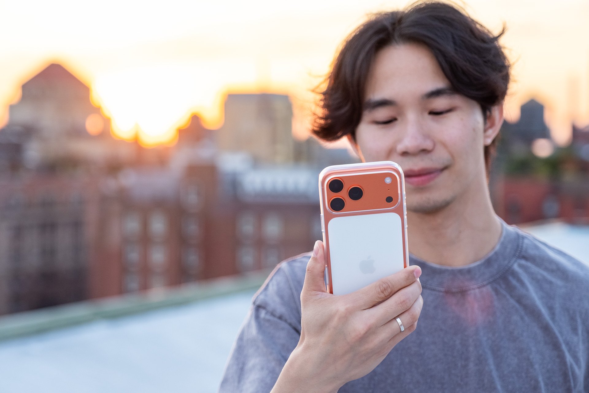 iPhone 17 Pro Max in Cosmic Orange with Apple clear case