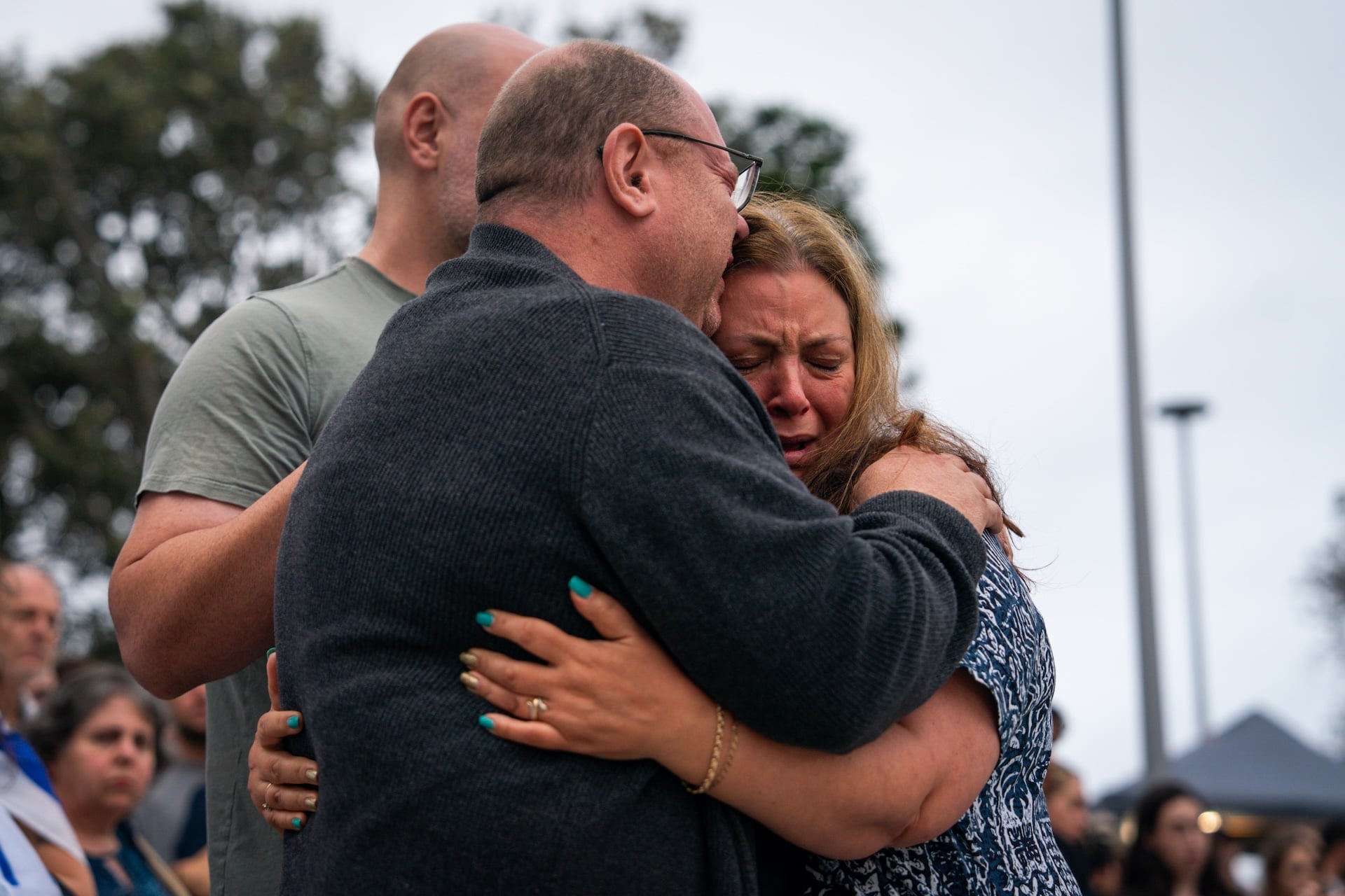 The parents of 10-year-old shooting victim, Matilda Poltavchenko, attend a memorial at Bondi Pavilion at Bondi Beach on December 15, 2025 in Sydney, Australia. 