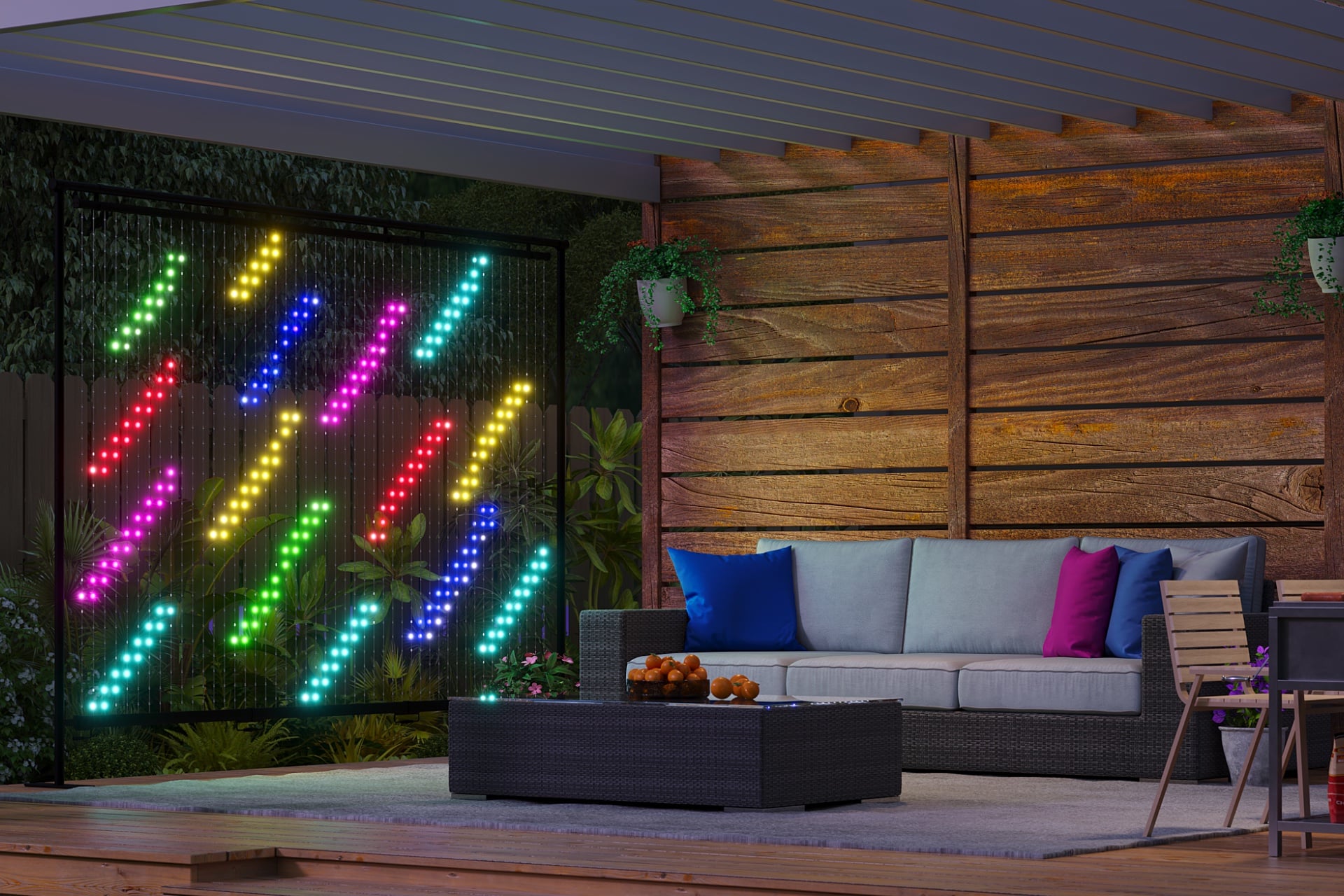 A Govee Lightwall on a patio displays a series of slashes in several different colors, leaving the space between dark, giving it a transparency effect.