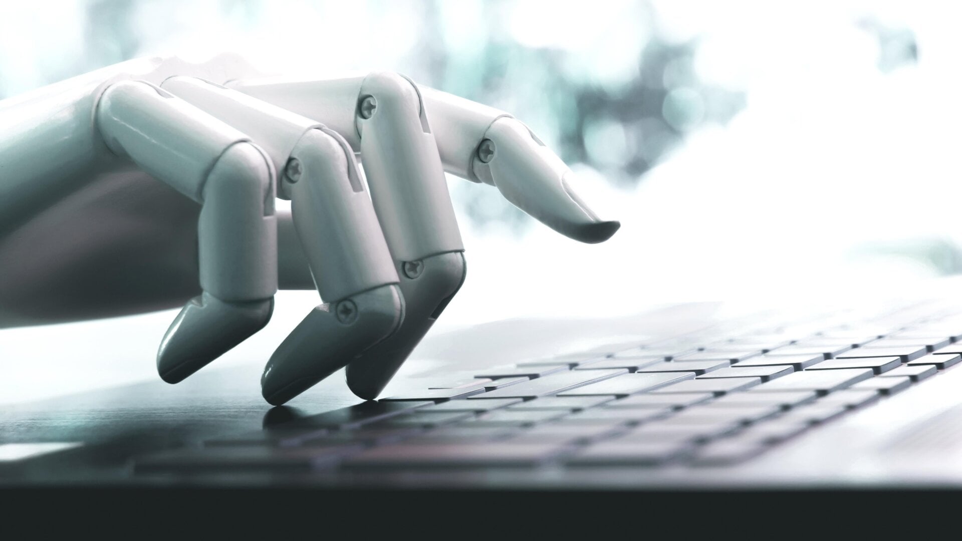 Image: <a href="https://www.shutterstock.com/image-photo/robot-concept-hand-chatbot-pressing-computer-1225785334" target="_blank">kung_tom</a>