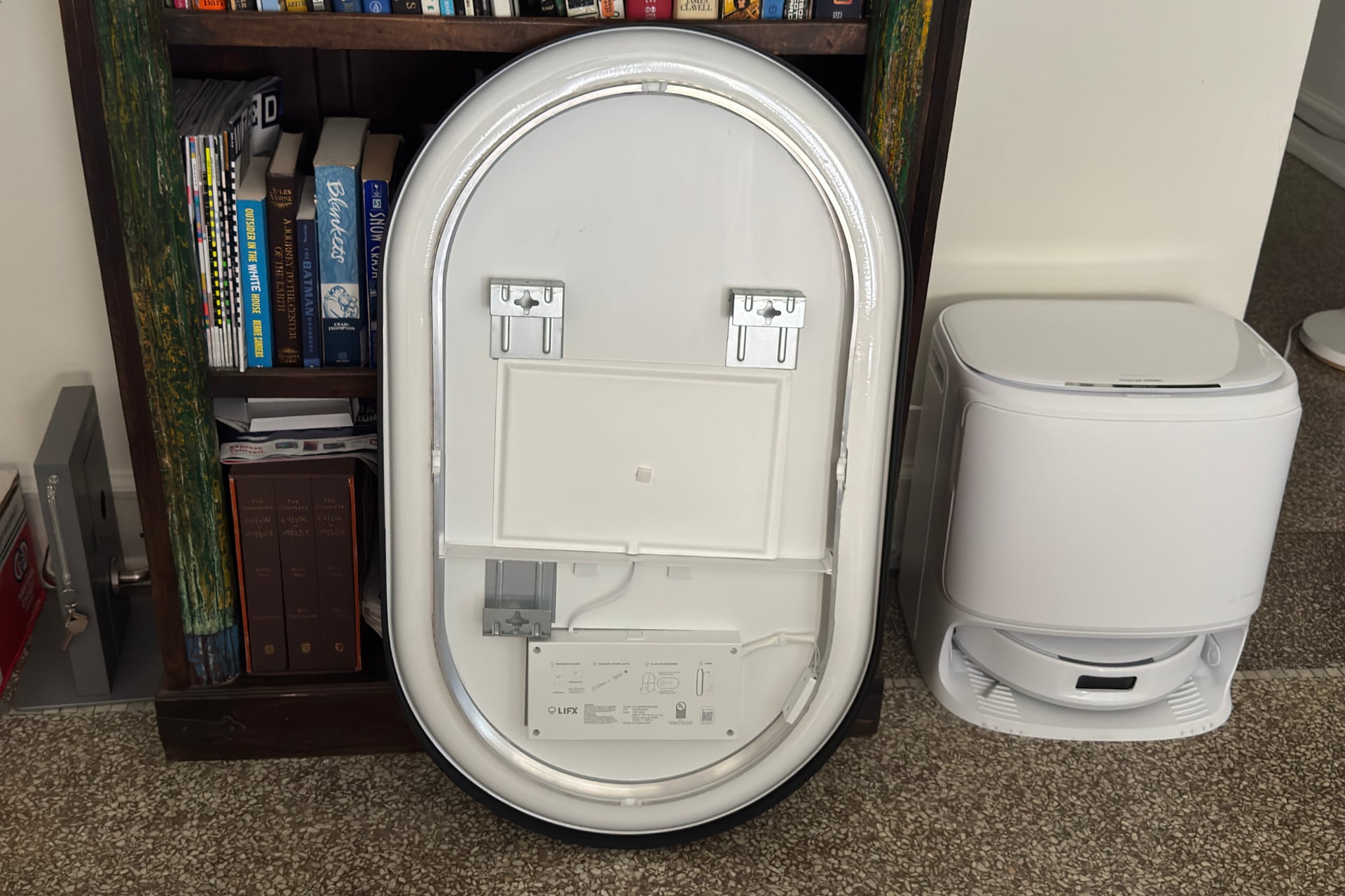The back of the smart mirror, showing its vertical and horizontal mounting points.